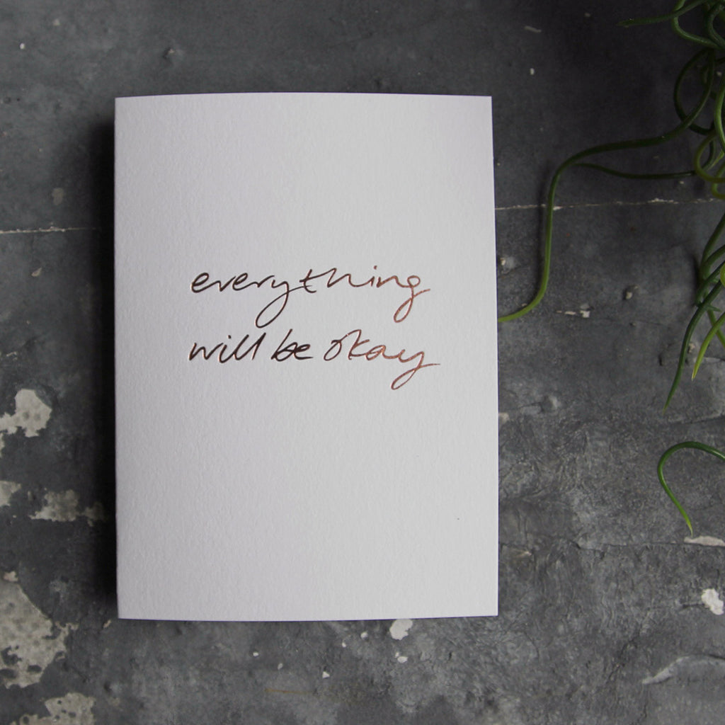 this hand foiled luxury white card says Everything Will Be Okay on the front in rose gold foil