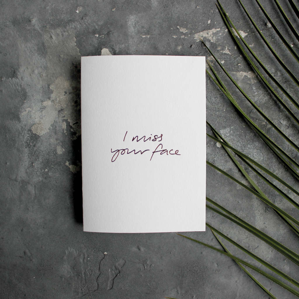 The front of this luxury card says I Miss Your Face, handwritten and hand foiled in rose gold foil