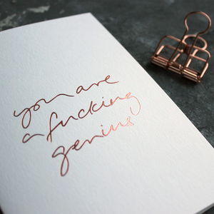 You Are A Fucking Genius is a luxury white card hand foiled in rose gold on the front